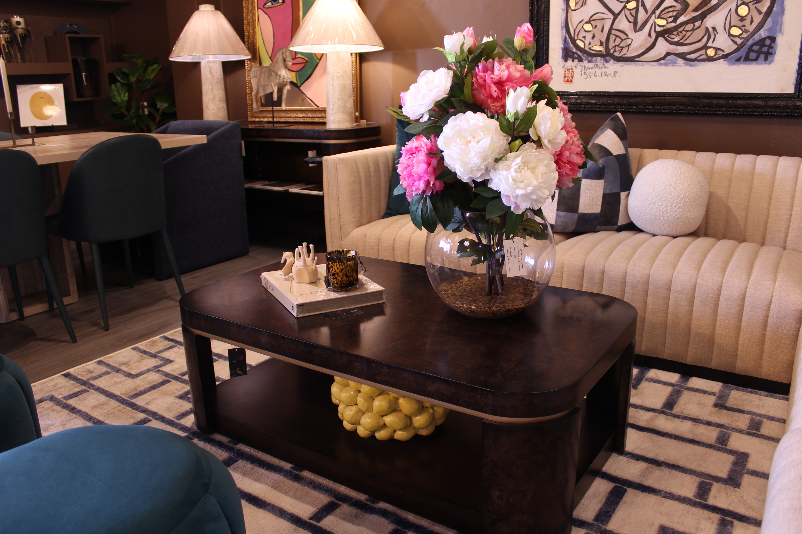 A styled Daja showroom lounge arranged around a floral centerpiece